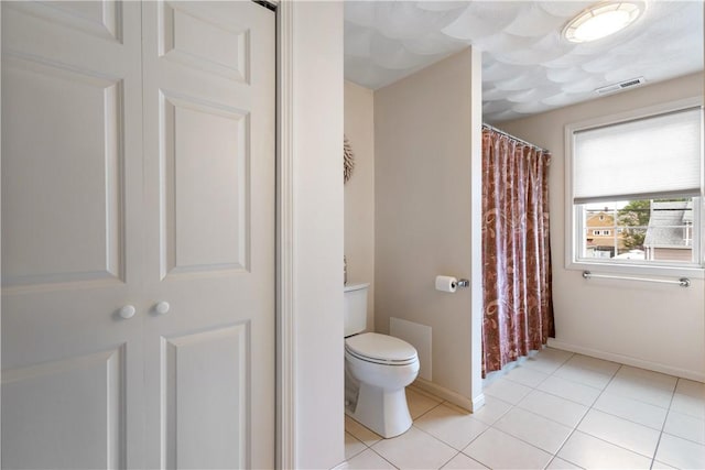 53 Hyde Ave, Pawtucket, RI 02861 - bathroom with toilet, tile patterned floors, baseboards, and curtained shower