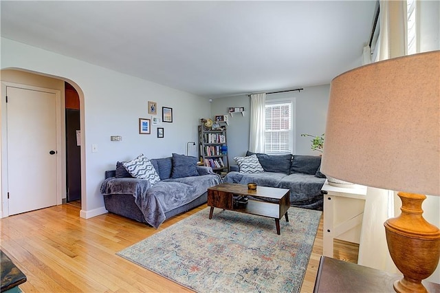 80 Barrett Ave, North Providence, RI 02904 - living room featuring arched walkways and light wood finished floors