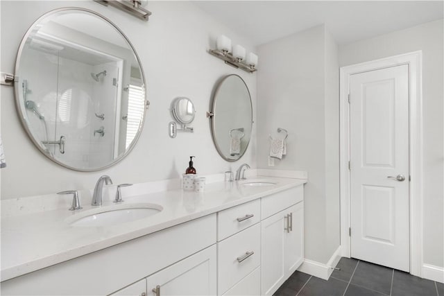 40 Kettle Point Ave, East Providence, RI 02914 - full bathroom with tile patterned flooring, double vanity, and a stall shower