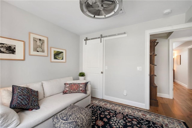 40 Kettle Point Ave, East Providence, RI 02914 - living room with a barn door and wood finished floors
