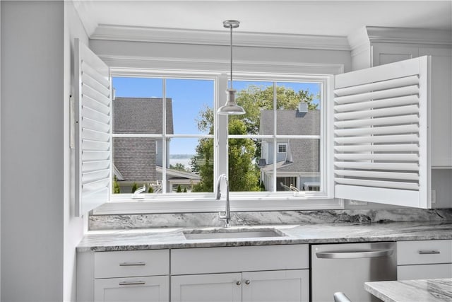 40 Kettle Point Ave, East Providence, RI 02914 - kitchen with stainless steel dishwasher, white cabinetry, crown molding, hanging light fixtures, and light stone counters