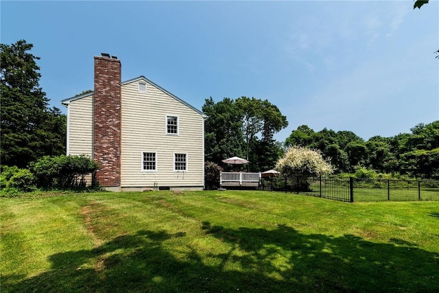 59 Intrepid Ln, Jamestown, RI 02835 - view of home's exterior featuring a chimney and a wooden deck