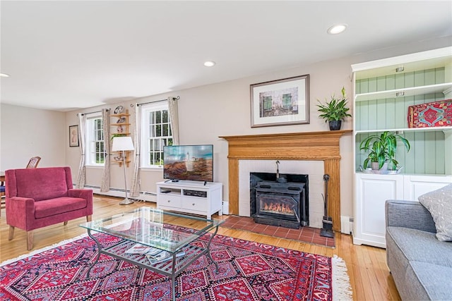 59 Intrepid Ln, Jamestown, RI 02835 - living area with wood finished floors, recessed lighting, and a baseboard heating unit
