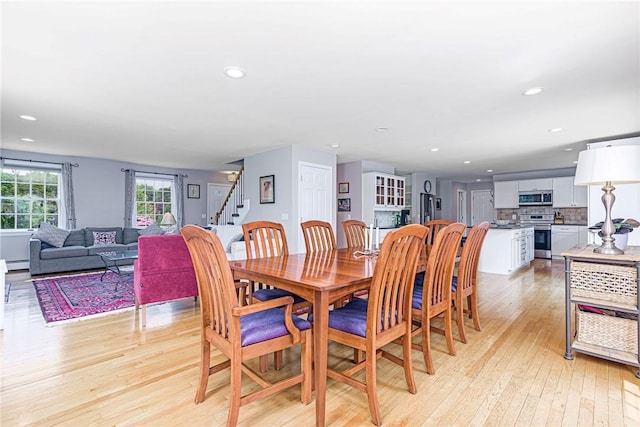 59 Intrepid Ln, Jamestown, RI 02835 - dining room featuring light wood-style flooring, recessed lighting, and stairs