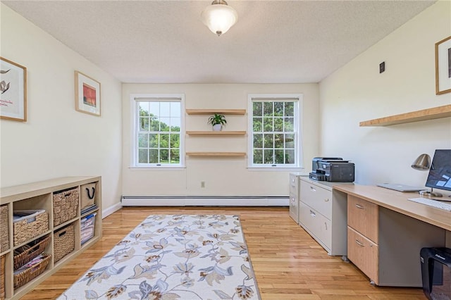 59 Intrepid Ln, Jamestown, RI 02835 - office area featuring a baseboard heating unit, light wood-style flooring, and a textured ceiling