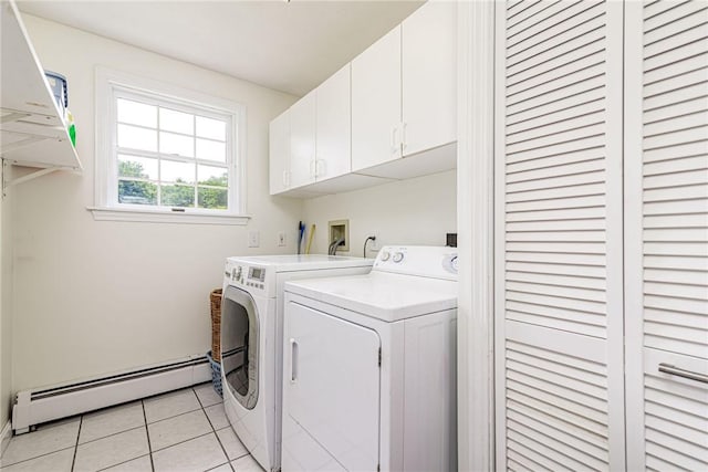 59 Intrepid Ln, Jamestown, RI 02835 - laundry room with a baseboard heating unit, cabinet space, washing machine and clothes dryer, and light tile patterned flooring