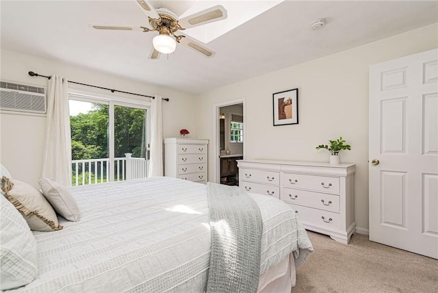 59 Intrepid Ln, Jamestown, RI 02835 - bedroom with access to exterior, a wall mounted air conditioner, light colored carpet, connected bathroom, and a ceiling fan