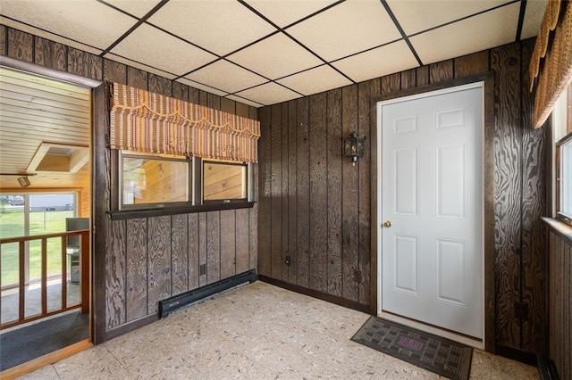 19 Cindy Ln, Coventry, RI 02816 - entrance foyer with a drop ceiling, wood walls, and baseboards