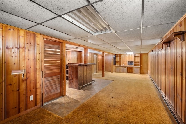 19 Cindy Ln, Coventry, RI 02816 - finished basement featuring a bar, wood walls, carpet, and a drop ceiling