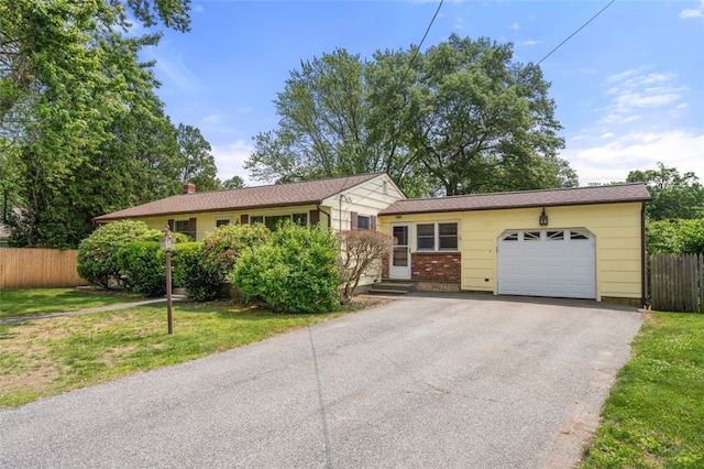 19 Cindy Ln, Coventry, RI 02816 - view of front of house featuring an attached garage and driveway