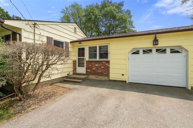 19 Cindy Ln, Coventry, RI 02816 - view of front of home with driveway and a garage