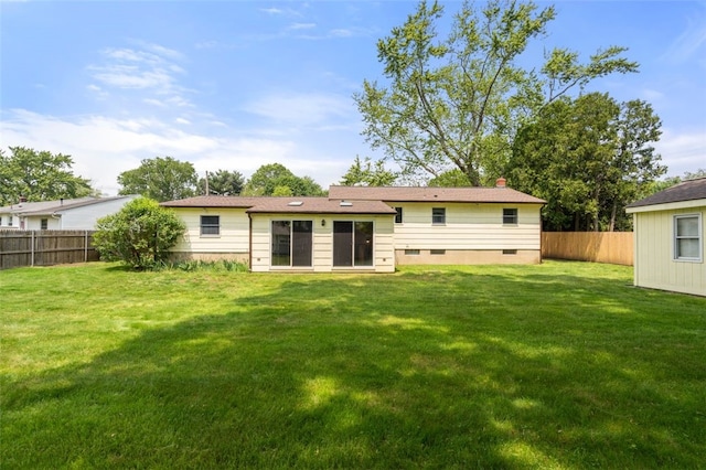 19 Cindy Ln, Coventry, RI 02816 - rear view of house with crawl space and a chimney