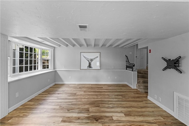 694 Windwood Dr Unit C, Tiverton, RI 02878 - unfurnished room with stairs, wood finished floors, beam ceiling, and baseboards