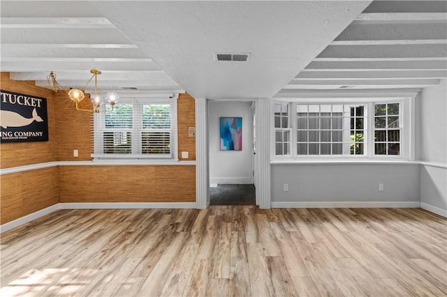 694 Windwood Dr Unit C, Tiverton, RI 02878 - foyer with a chandelier, wood finished floors, and baseboards