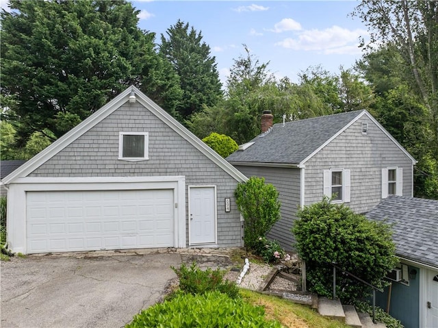 694 Windwood Dr Unit C, Tiverton, RI 02878 - traditional-style home with roof with shingles, a chimney, an outdoor structure, and a detached garage