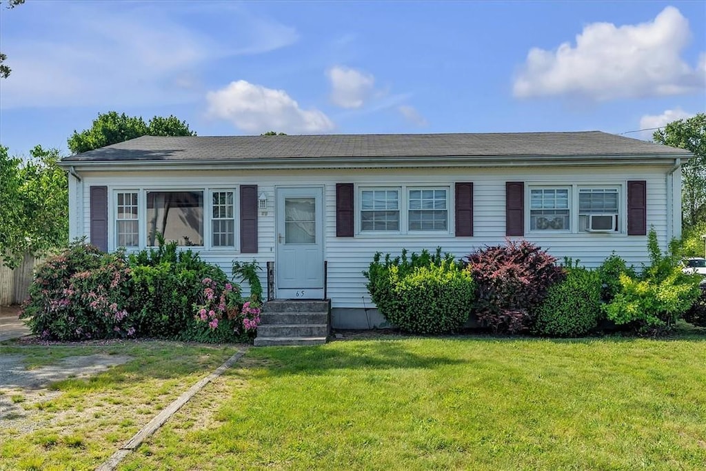 65 Ingalls St, Warwick, RI 02889 - view of front of house with entry steps and a front yard