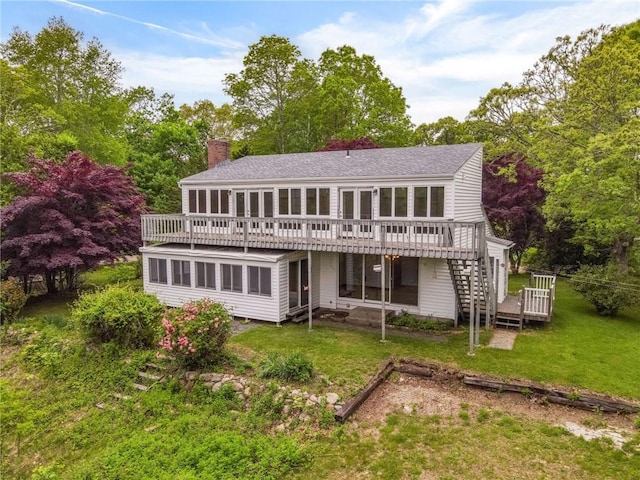 10 Joanth Ter, Westerly, RI 02891 - back of house featuring a deck, a chimney, stairs, a lawn, and a sunroom