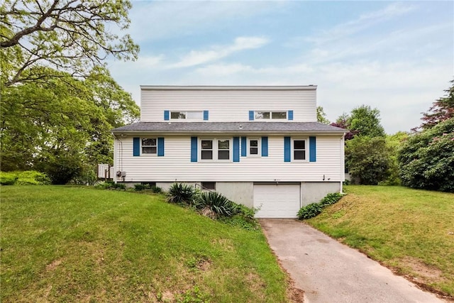 10 Joanth Ter, Westerly, RI 02891 - view of front of house featuring concrete driveway, a garage, and a front lawn