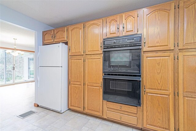 10 Joanth Ter, Westerly, RI 02891 - kitchen with freestanding refrigerator and a chandelier