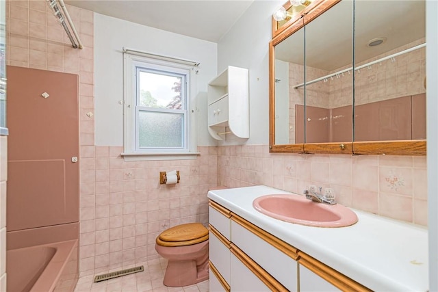 10 Joanth Ter, Westerly, RI 02891 - full bath with tile walls, vanity, toilet, and tile patterned floors