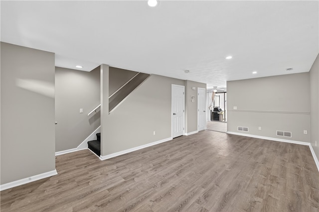 403 Pinewood Dr, Smithfield, RI 02917 - unfurnished living room with recessed lighting, stairway, baseboards, and wood finished floors