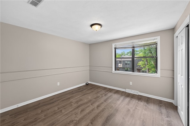 403 Pinewood Dr, Smithfield, RI 02917 - unfurnished bedroom featuring baseboards, wood finished floors, and a closet