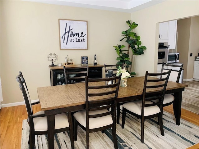 20 Canton Ct, Cranston, RI 02921 - dining room with light wood-style flooring and baseboards