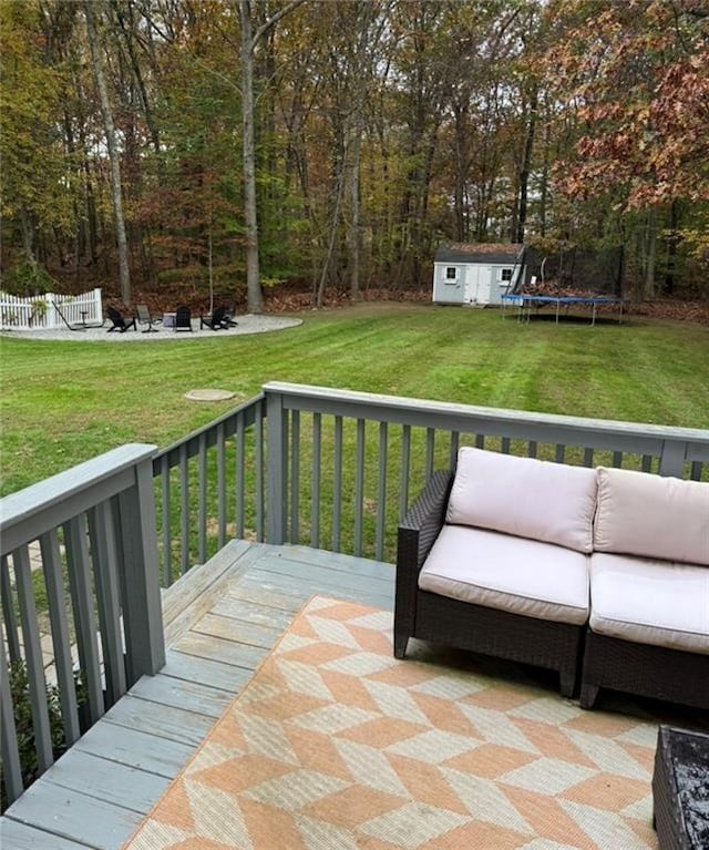 20 Canton Ct, Cranston, RI 02921 - wooden terrace featuring a trampoline, a yard, and an outdoor living space