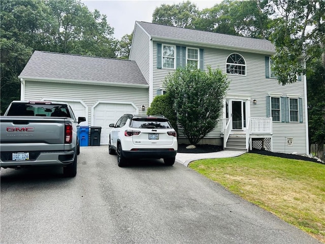 20 Canton Ct, Cranston, RI 02921 - colonial home featuring driveway, a front lawn, and an attached garage
