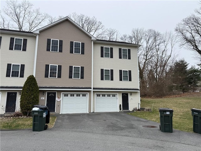 75 Esmond St Unit 5D, West Warwick, RI 02893 - view of property featuring asphalt driveway, an attached garage, and a front lawn