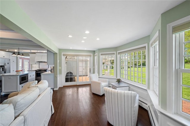 31 Peaceful Way, Tiverton, RI 02878 - living area with plenty of natural light, dark wood-style floors, recessed lighting, and baseboards