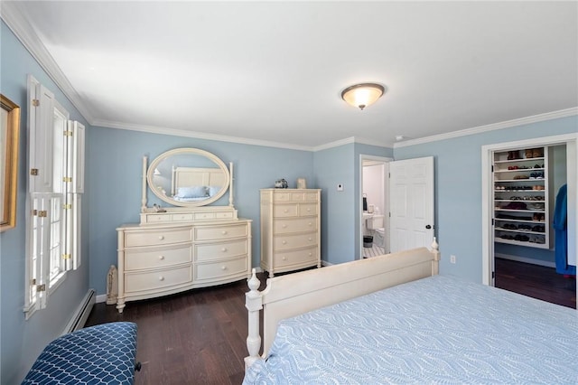31 Peaceful Way, Tiverton, RI 02878 - bedroom with dark wood-style flooring, crown molding, a baseboard heating unit, a walk in closet, and baseboards