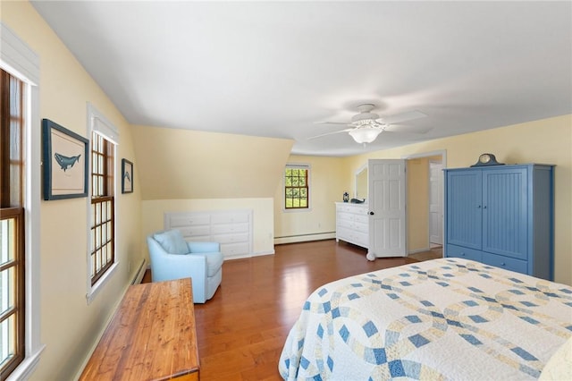 31 Peaceful Way, Tiverton, RI 02878 - bedroom with baseboard heating, dark wood-style flooring, ceiling fan, and a baseboard radiator