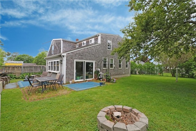 23 Sherman Ln, Middletown, RI 02842 - rear view of house featuring a patio area and a fire pit