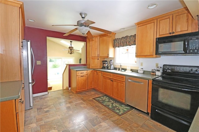 23 Sherman Ln, Middletown, RI 02842 - kitchen with black appliances, ceiling fan, stone finish floors, recessed lighting, and brown cabinetry