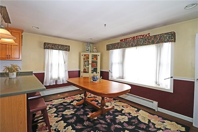 23 Sherman Ln, Middletown, RI 02842 - dining space featuring baseboard heating, healthy amount of natural light, wood finished floors, and recessed lighting