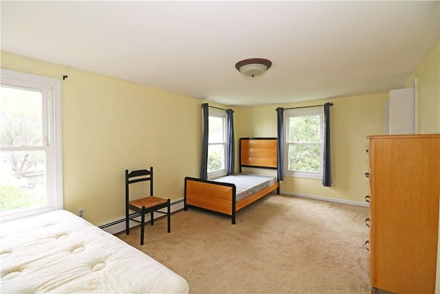 23 Sherman Ln, Middletown, RI 02842 - bedroom with light carpet and a baseboard radiator