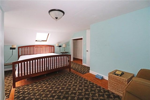 23 Sherman Ln, Middletown, RI 02842 - bedroom featuring wood finished floors, lofted ceiling, and a skylight