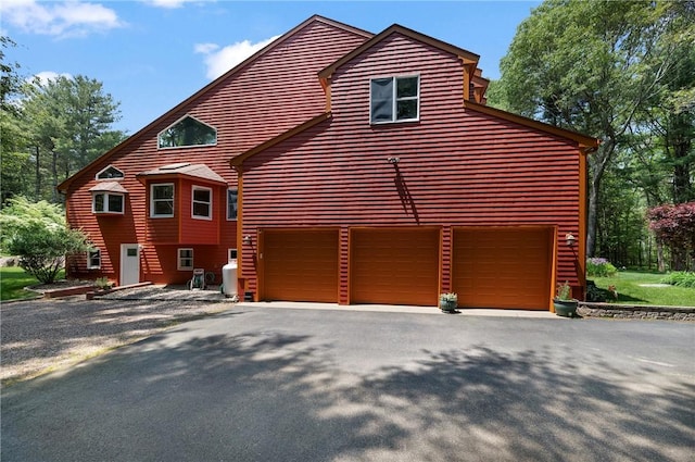 350 Austin Farm Rd, Exeter, RI 02822 - view of side of home with driveway and a garage