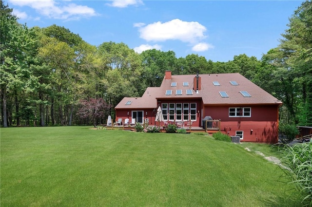 350 Austin Farm Rd, Exeter, RI 02822 - back of property featuring a chimney, a deck, and a lawn