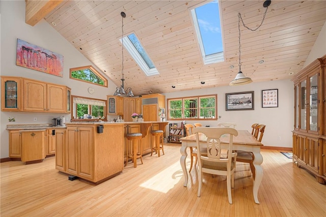 350 Austin Farm Rd, Exeter, RI 02822 - dining area with a skylight, high vaulted ceiling, light wood-style flooring, baseboards, and wooden ceiling with exposed beams