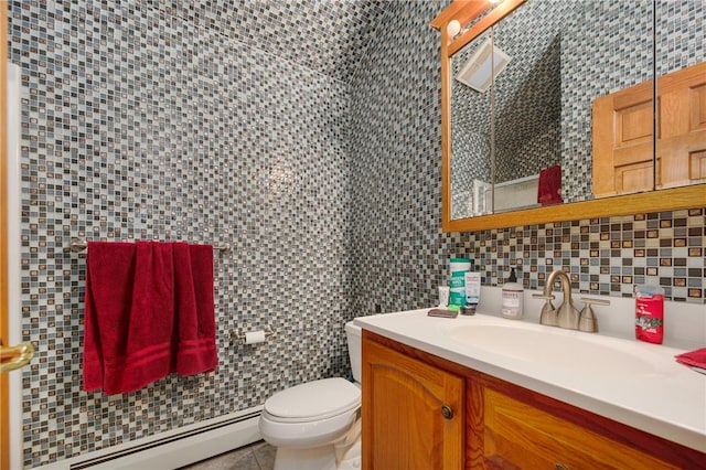 350 Austin Farm Rd, Exeter, RI 02822 - bathroom featuring a baseboard heating unit, vanity, toilet, tile walls, and backsplash