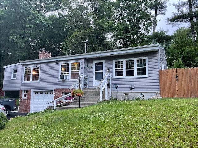 16 Bunny Trl, Scituate, RI 02831 - view of front facade featuring a garage, a chimney, cooling unit, and asphalt driveway