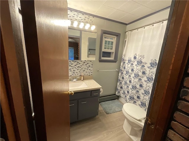 16 Bunny Trl, Scituate, RI 02831 - full bathroom with toilet, vanity, wood finished floors, tasteful backsplash, and ornamental molding