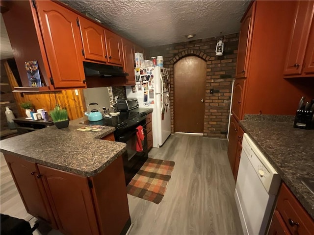 16 Bunny Trl, Scituate, RI 02831 - kitchen with white appliances, under cabinet range hood, light wood-style flooring, a peninsula, and a textured ceiling