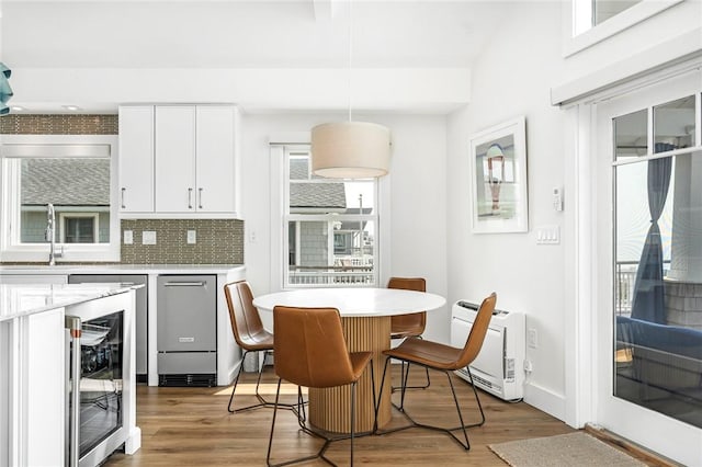 413 Atlantic Ave, Westerly, RI 02891 - dining area featuring wine cooler, healthy amount of natural light, light wood finished floors, heating unit, and recessed lighting