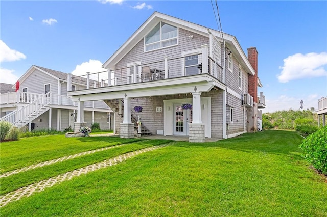 413 Atlantic Ave, Westerly, RI 02891 - shingle-style home with a balcony, a front yard, a chimney, and stairway