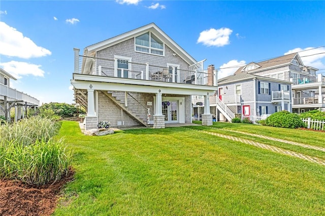 413 Atlantic Ave, Westerly, RI 02891 - rear view of house featuring stairway, a yard, and french doors