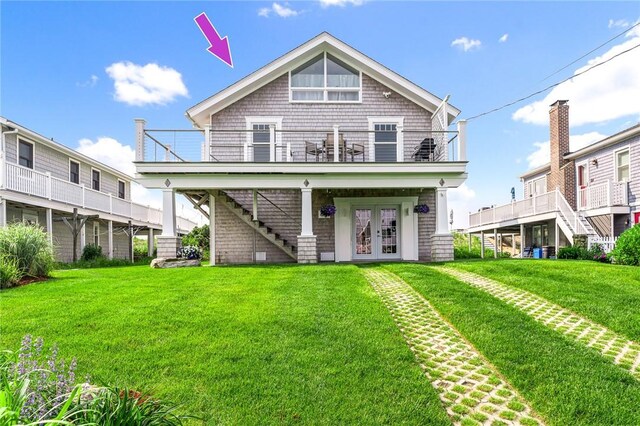 413 Atlantic Ave, Westerly, RI 02891 - back of property with french doors, stairs, and a lawn