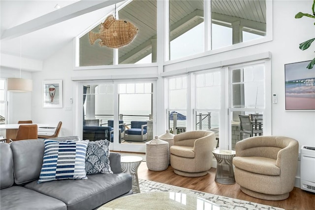 413 Atlantic Ave, Westerly, RI 02891 - living area featuring plenty of natural light, wood finished floors, high vaulted ceiling, and beam ceiling